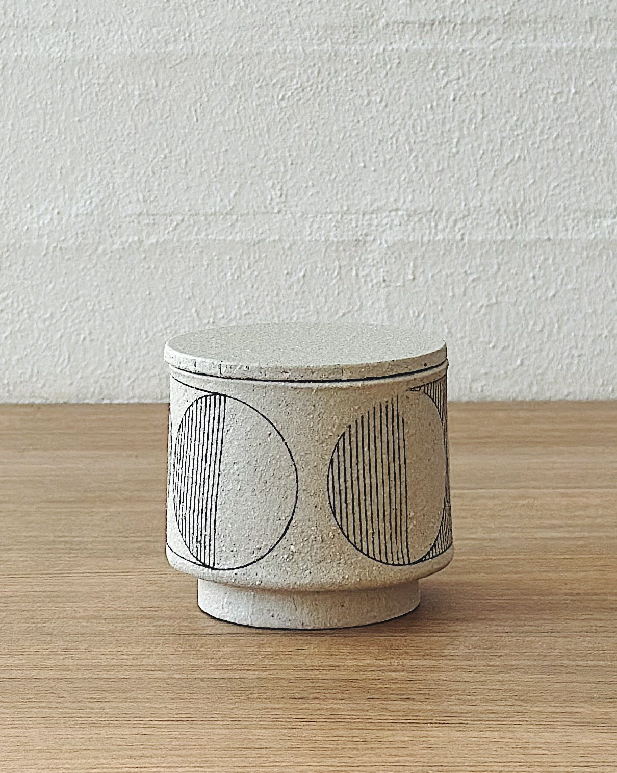 geometric white lidded vessel