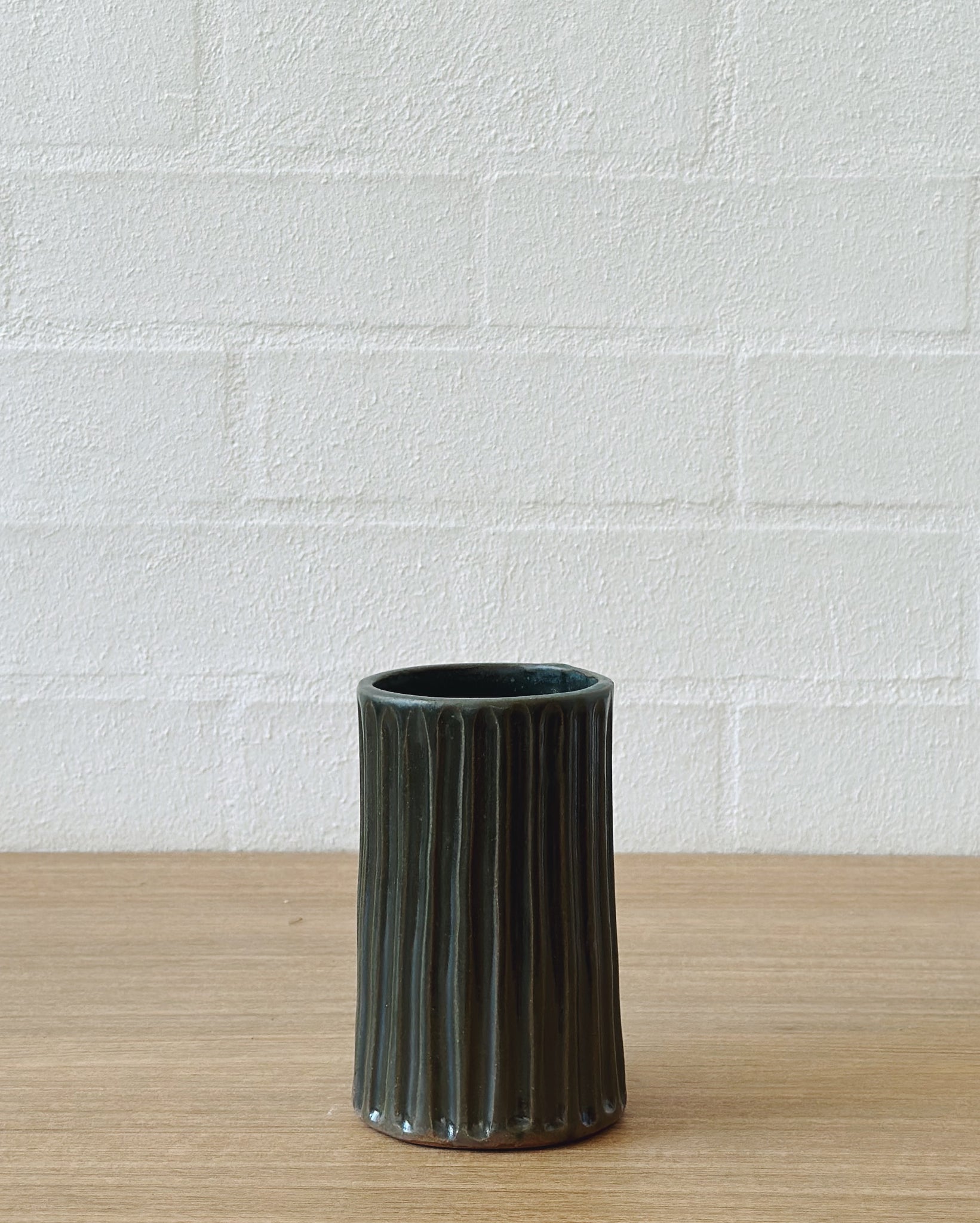 carved moody green vaseUP